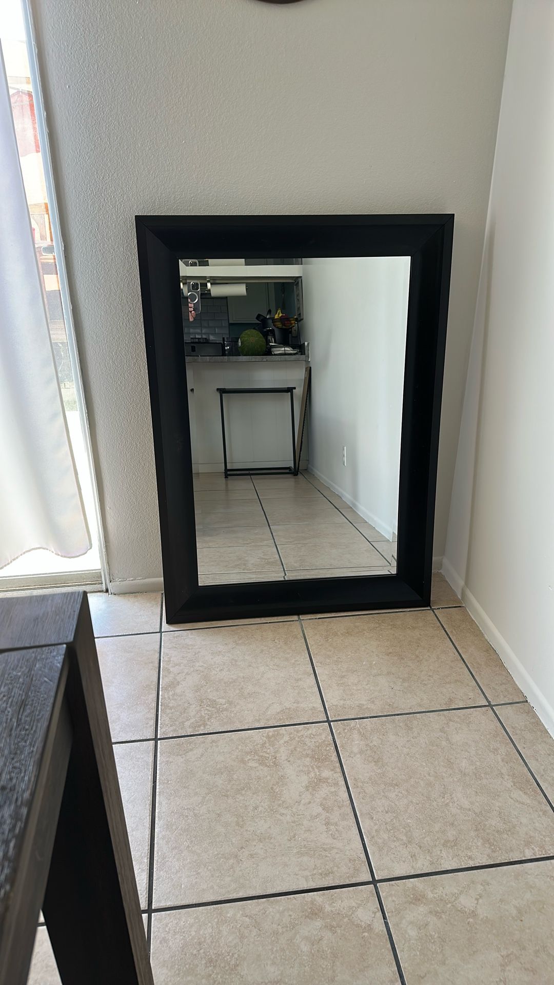 Dark brown wall mirror