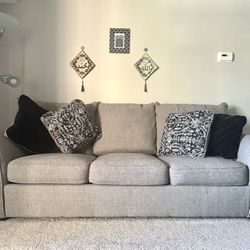 3 seater couch with 4 pillows.
