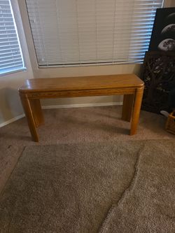 Behind the couch table/ side table