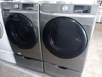 Samsung gray front load washer and dryer set on pedestals - Free delivery