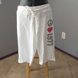 Large "peace, love, 1977" white shorts by na na fashion

