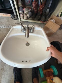 Glacier Bay white sink with faucet