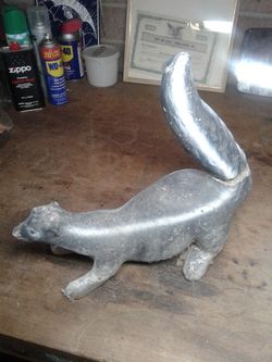 Vintage skunk lawn art