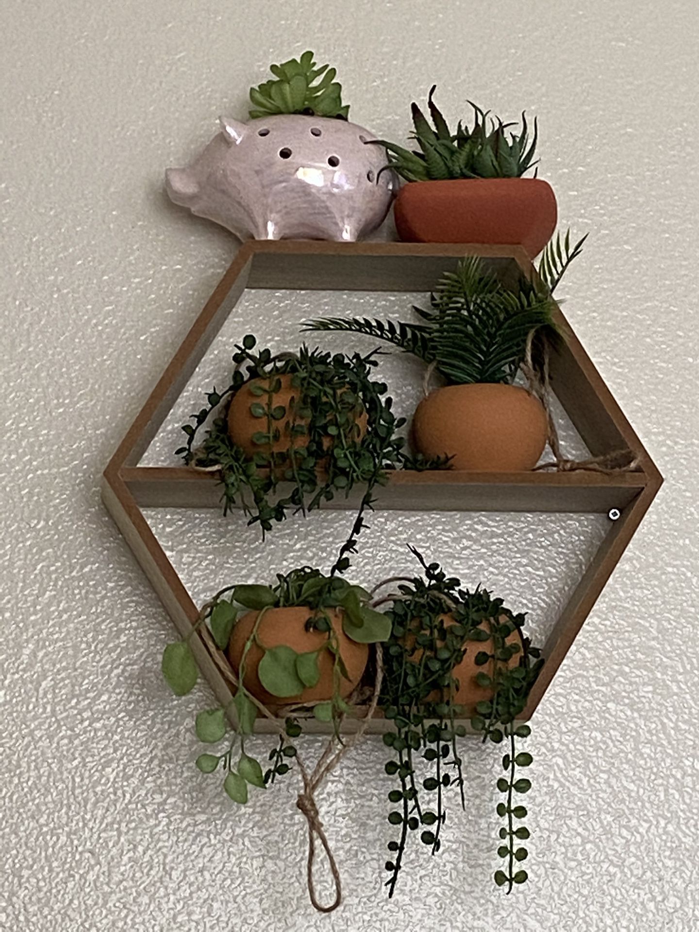 Shelf with fake plants included