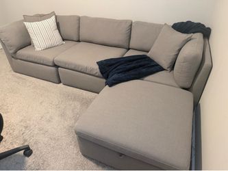 Gray modular sectional with storage. $250