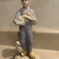 Vintage Boy Holding Goose Figurine
