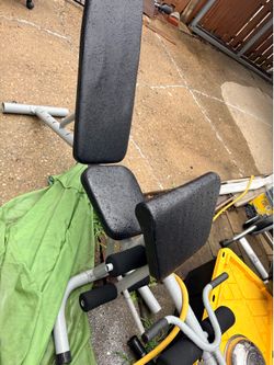 Weight bench, punching bag & misc workout equipment