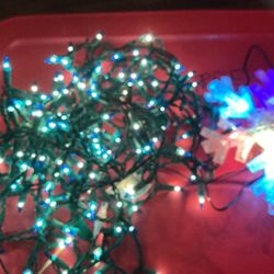 Blue and white two strand of Christmas lights with light up snowflake