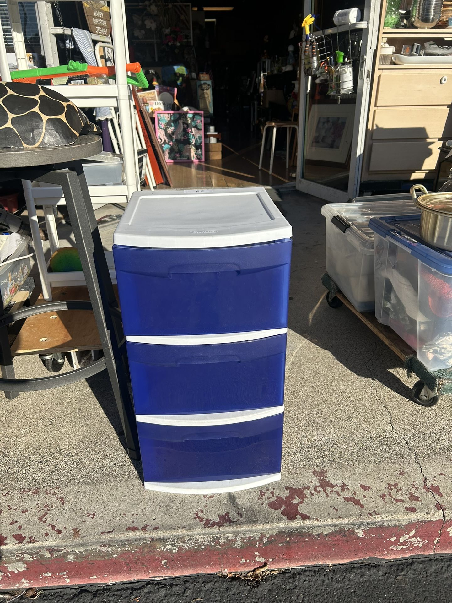 3-drawer plastic storage unit with a white frame and blue drawers