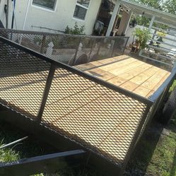 21' x 5 1/2' steel trailer dual axle with new wood new lights new bearings new tires