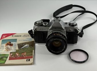 Canon AE-1 35mm SLR Film Camera Silver w/ FD 50mm f/1.8 S.C. Lens