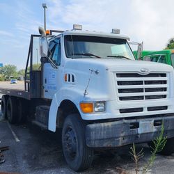 Heavy equipment roll back with 28 foot bed. Tandome  axle with cat engine.