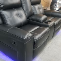 Ashley black sofa love with blue floor lighting