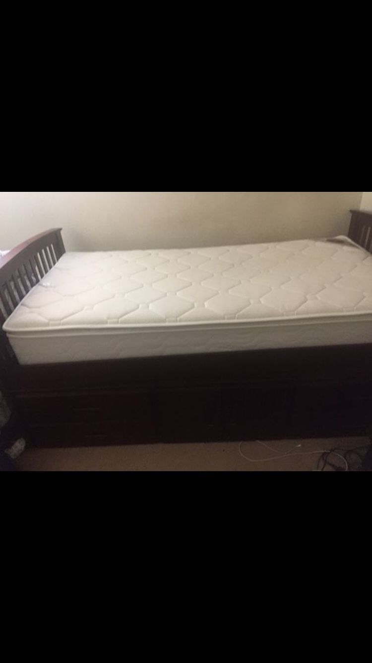 Twin bed with wooden frame and storage box (serious enquires only)