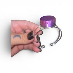 Red and purple 3D printed chap stick jars on a silver bracelet