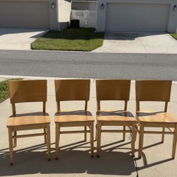 Selling 4 wooden chairs.