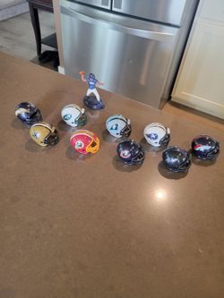 Miniature plastic football helmets & 1 Madden Bronco player
