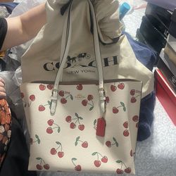 Coach Purse Cherry $179.00.  Coach Purse Strawberry  $170.00. Coach Purse White With Flowers $200.00