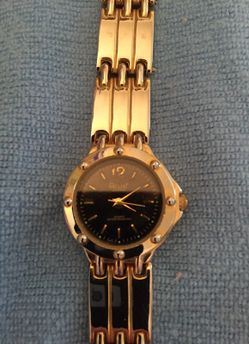 Woman's silver tone watch with silver tone bracelet band