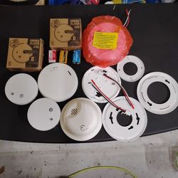 $60 variety of 7 smoke detectors and spare parts batteries included o.b.o