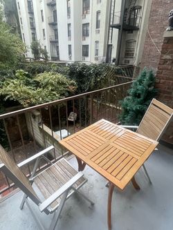 Patio table and folding chairs.
