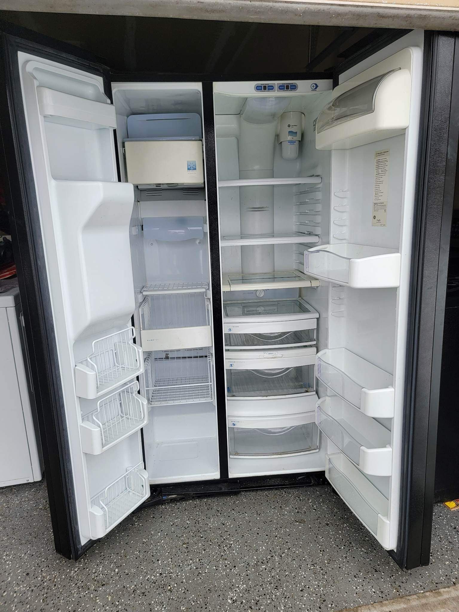 GE Side-by-side black side-by-side refrigerator in excellent