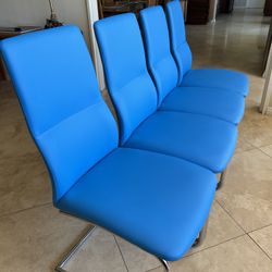 4 Blue Chairs W/ Metal Framing. 