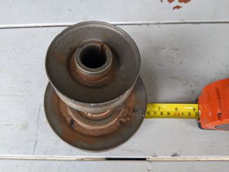 Riding commercial lawn mower blade shaft pulley