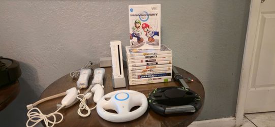 Nintendo Wii Bundle. Console. Mario Kart. Racing Wheels 
11 Games and Accessories. Loaded