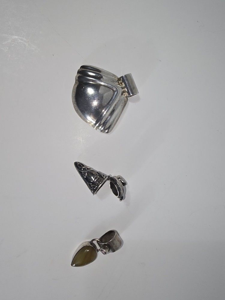 Three Sterling Silver Pendants Collectively Weighing 18.8 DWT