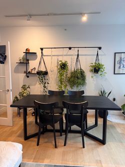 CB2 black wood table with meal base and 4 chairs