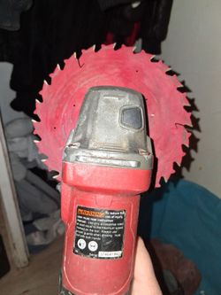Red Angle Grinder with Saw Blades
