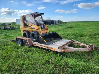 case skidsteer bobcat and trailer