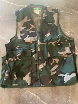 Game Winner Sportswear Green and brown camouflage vest with multiple pockets and blood proof bag on back.  