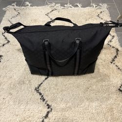 black gucci monogram weekend / duffel bag