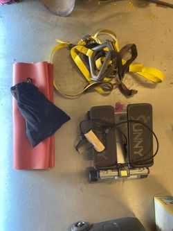 Small gym set up: TRX, stepper, yoga mat
