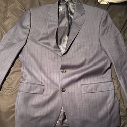 This is a pair of Lauren Ralph Lauren shadow piece garment trousers in blue, made from 100% wool, size 39 REG 33W