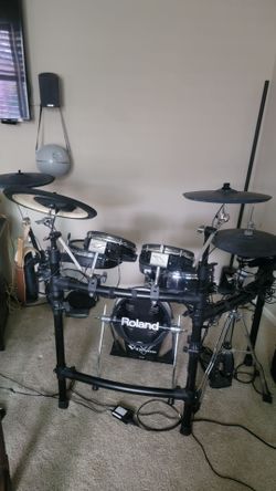Roland TD25KV electronic drum kit with a few upgrades.