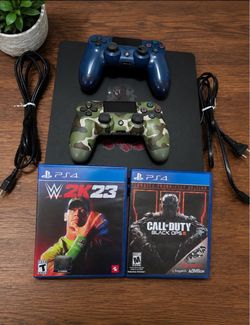 PlayStation 4 slim with 2 controlls and 2 games. 1 TB