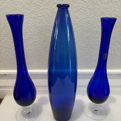 3 elegant blue glass vases. Unique. It will be very beautiful when placed in your home.