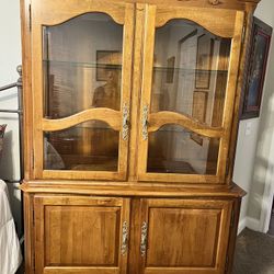 Ethan Allen 2 part china cabinet with beveled glass 