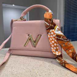 Pink leather handbag