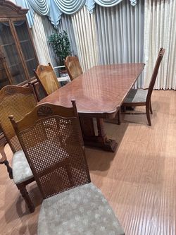 Wood Dining Table with 5Cane Back Chairs and China cabinet