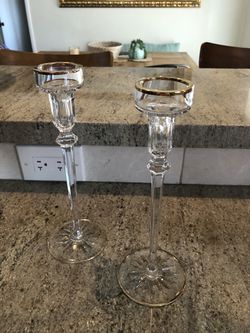Gold rimmed wine glasses and candle holders
