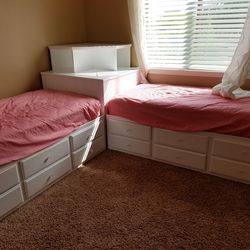 corner captain's bed (sometimes called a corner daybed or L-shaped storage bed)