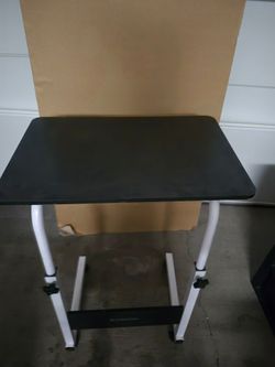 adjustable bed table.