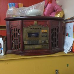Has A Record Player A CD Player And A Cassette Player