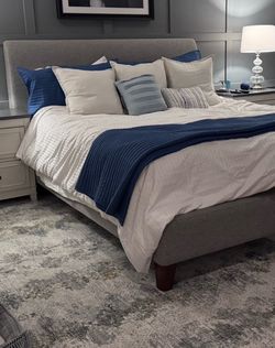Cal King bed. Upholstered with adjustable base