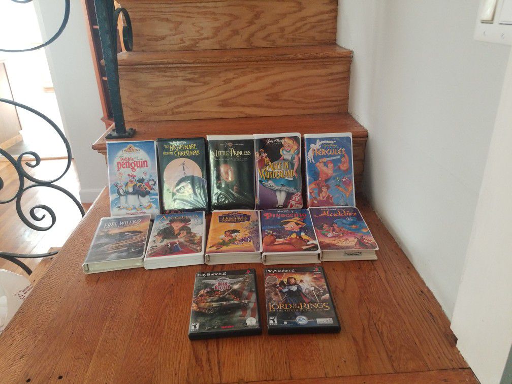 Varies Vhs Movies and Two Play Stations 2; Seek and Destroy and Lords Of  the Lord Of The Rings