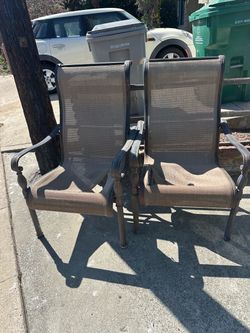 Two free outdoor patio chairs ripped fabric needs replacement